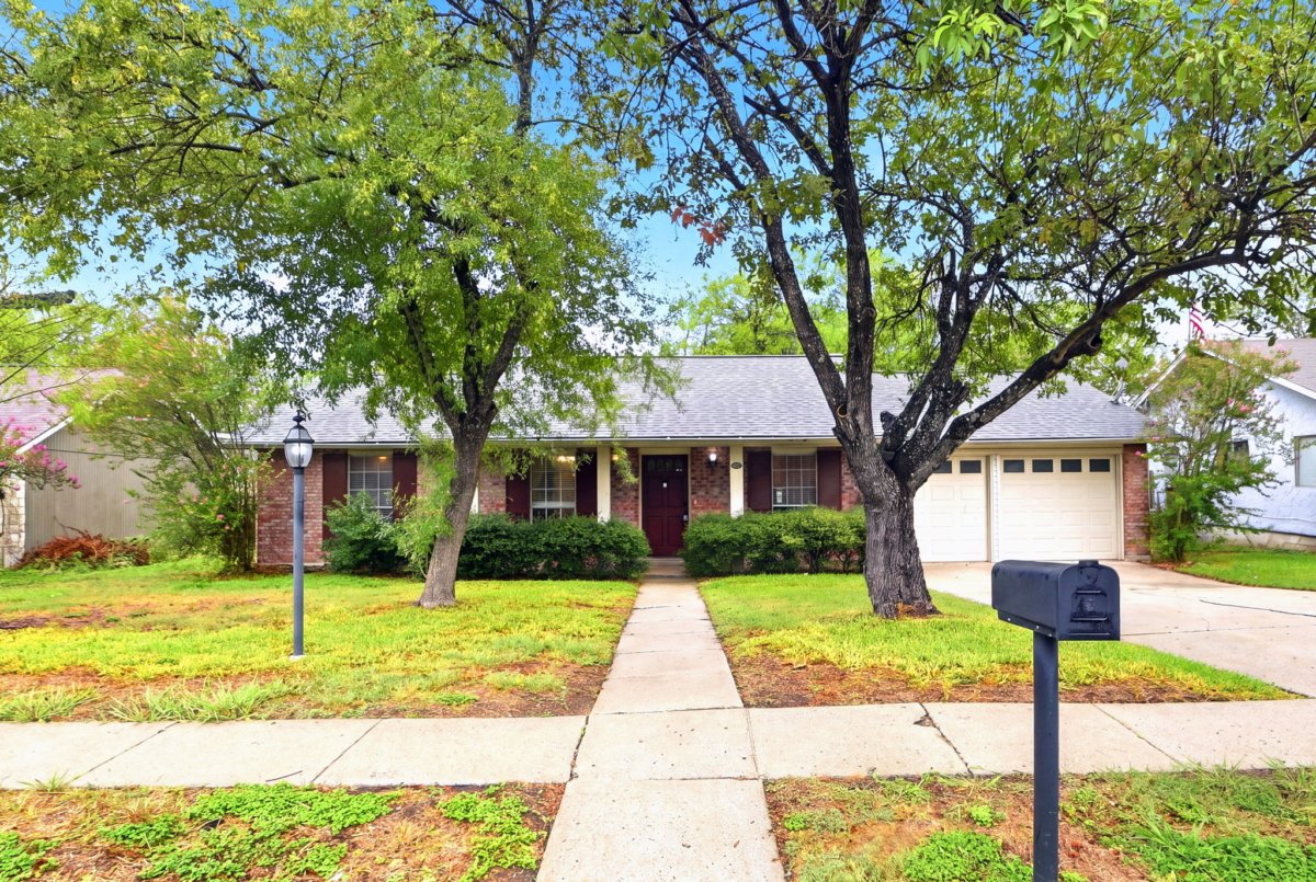 Front yard and entrance of a single-story rental home in Northeast San Antonio, Texas