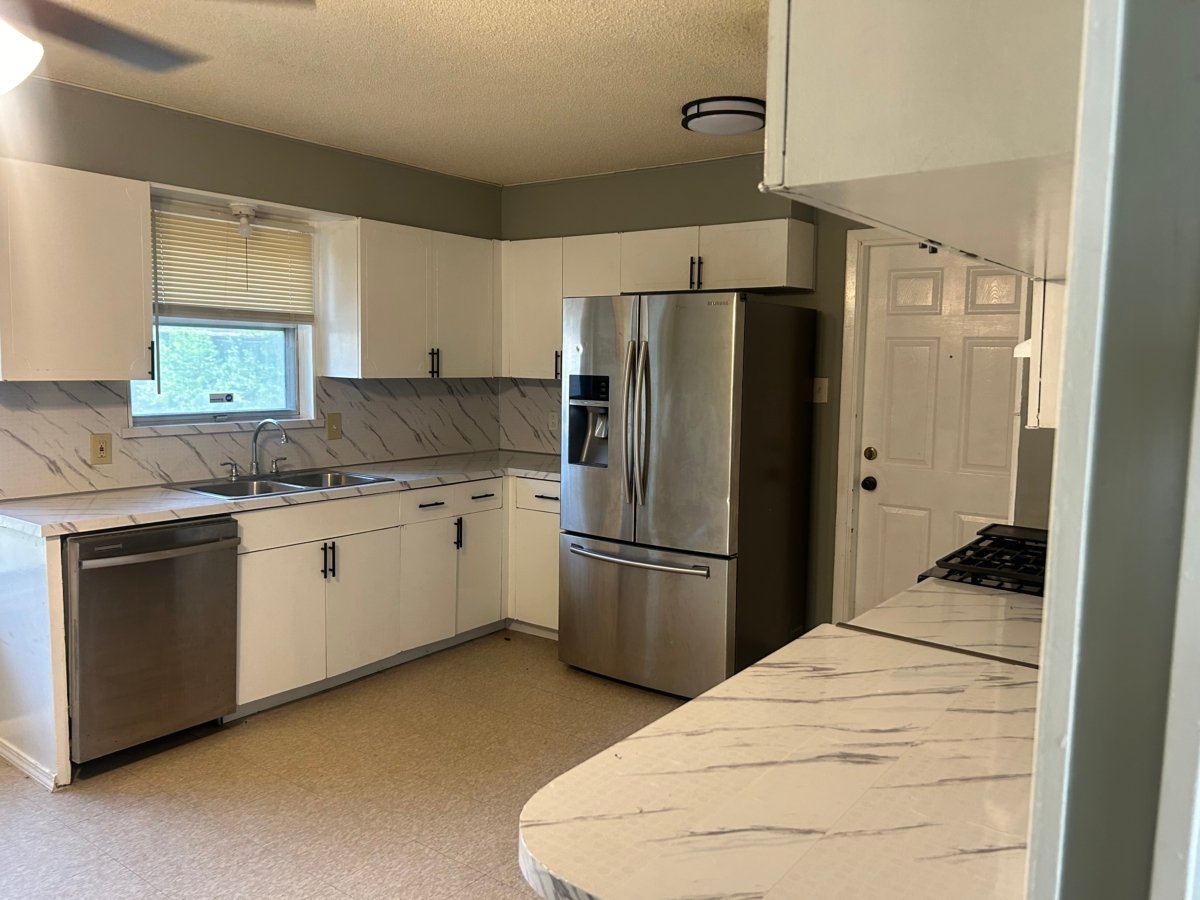 Updated kitchen with stainless steel appliances in a voucher-friendly San Antonio rental